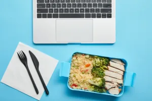 top view of laptop keyboard and plastic lunch box 2024 11 08 05 56 26 utc